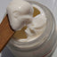 Jar of hyper vitalizer cream with a wooden spatula, featuring the brand 'emerginC'.