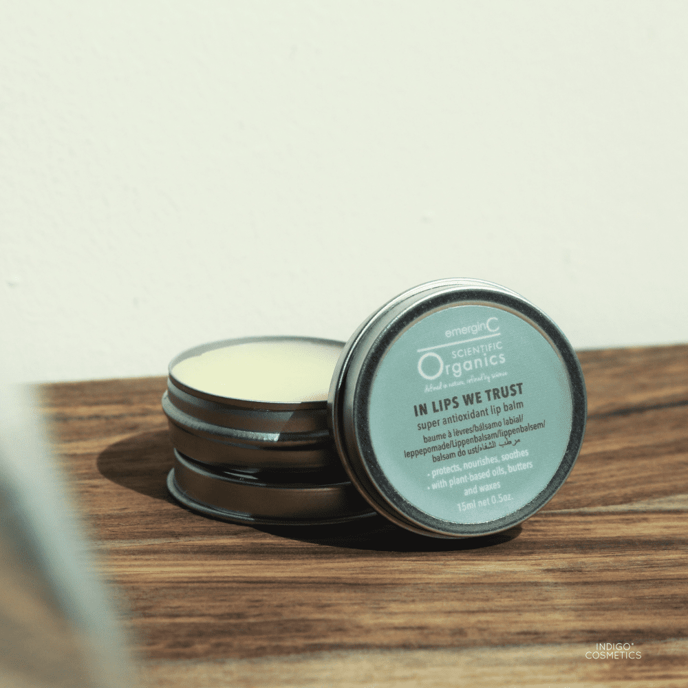 in lips we trust lip balm open on wood shelf